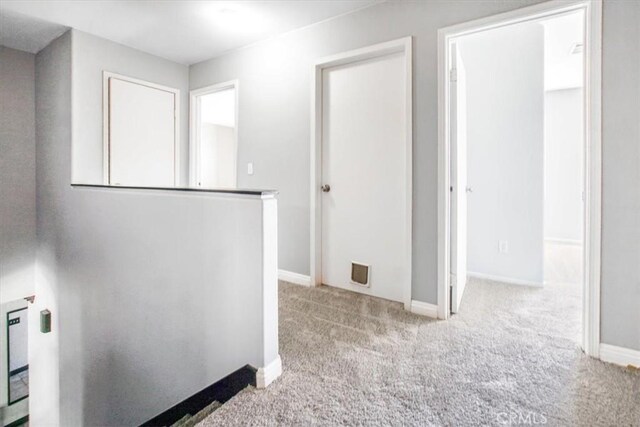 5794 Bay Hill Ln, Fontana, CA 92336 - corridor featuring carpet floors and baseboards