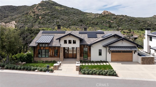 2775 Calbourne Ln, Westlake Village, CA 91361 - view of front facade featuring a standing seam roof, driveway, and a mountain view
