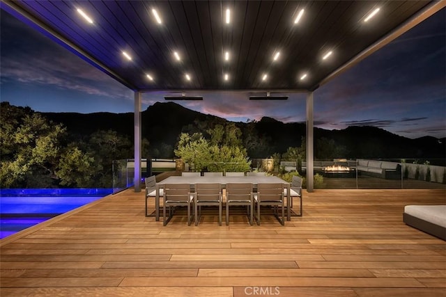 2775 Calbourne Ln, Westlake Village, CA 91361 - deck with an outdoor pool, outdoor dining space, and a mountain view