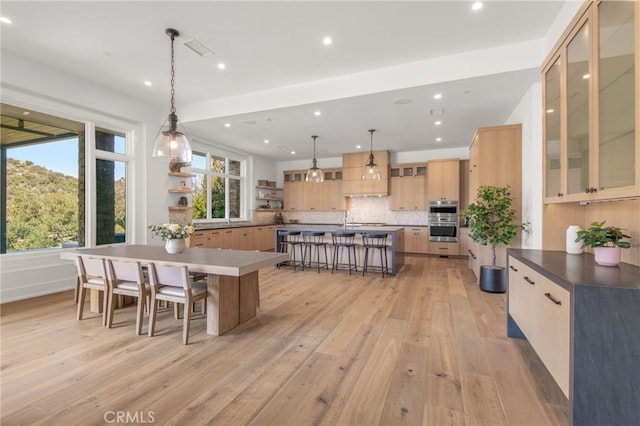 2775 Calbourne Ln, Westlake Village, CA 91361 - kitchen with a kitchen bar, a spacious island, light wood-style floors, open shelves, and recessed lighting