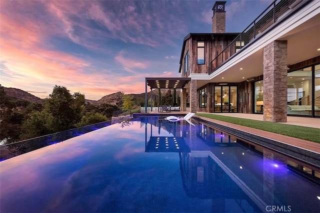 2775 Calbourne Ln, Westlake Village, CA 91361 - view of swimming pool featuring a patio area and an infinity pool