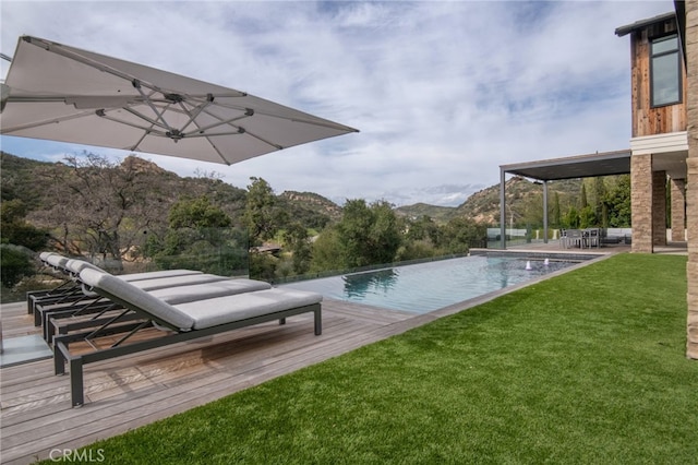 2775 Calbourne Ln, Westlake Village, CA 91361 - view of swimming pool with a lawn, an infinity pool, and a deck with mountain view