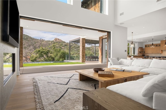 2775 Calbourne Ln, Westlake Village, CA 91361 - living area with light wood-style floors and a high ceiling