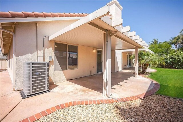 24347 Silver Bullet Way, Murrieta, CA 92562 - back of house featuring central AC, stucco siding, a patio, and a tile roof