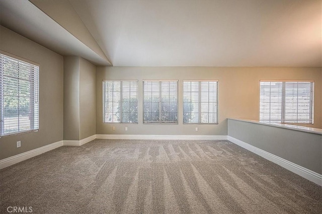 24347 Silver Bullet Way, Murrieta, CA 92562 - spare room featuring carpet floors, lofted ceiling, and baseboards