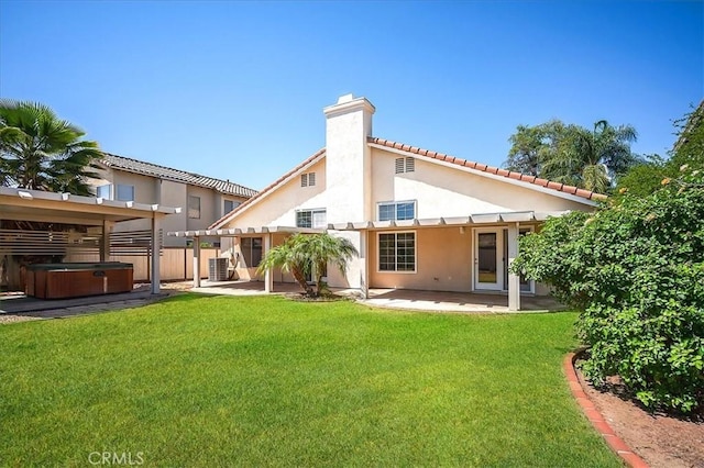 24347 Silver Bullet Way, Murrieta, CA 92562 - back of house with a hot tub, a patio area, stucco siding, a chimney, and a pergola