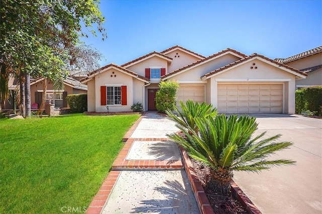 24347 Silver Bullet Way, Murrieta, CA 92562 - mediterranean / spanish-style home featuring an attached garage, stucco siding, driveway, a front lawn, and a tile roof