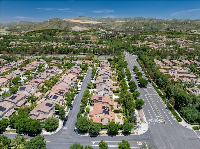 130 Yellow Daisy, Irvine, CA 92618 - aerial view of property's location featuring a mountainous background and nearby suburban area