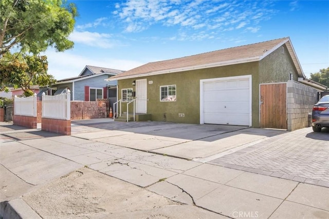5910 Brayton Ave, Long Beach, CA 90805 - ranch-style home featuring stucco siding, concrete driveway, and an attached garage