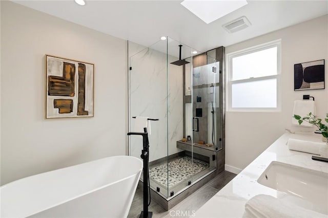 1802 Blossom Ln, Redondo Beach, CA 90278 - bathroom featuring a marble finish shower, a freestanding tub, double vanity, and recessed lighting