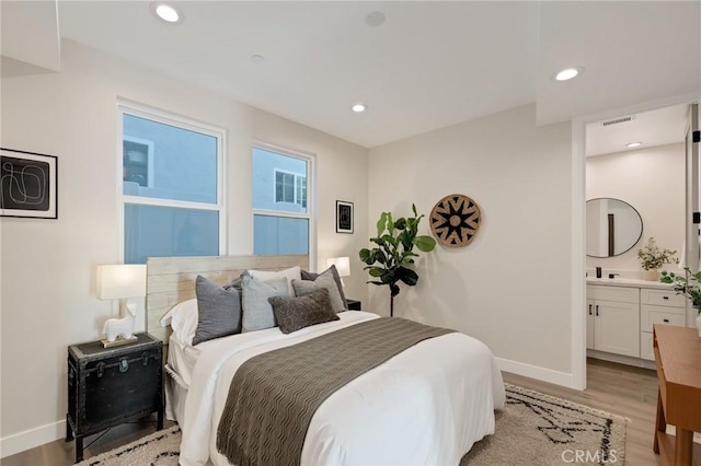 1802 Blossom Ln, Redondo Beach, CA 90278 - bedroom with light wood finished floors, recessed lighting, and ensuite bathroom