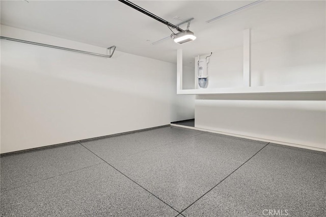 1802 Blossom Ln, Redondo Beach, CA 90278 - garage featuring a garage door opener and baseboards
