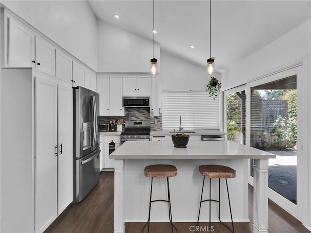 1761 Damon St, Simi Valley, CA 93063 - kitchen with appliances with stainless steel finishes, lofted ceiling, a sink, tasteful backsplash, and light countertops