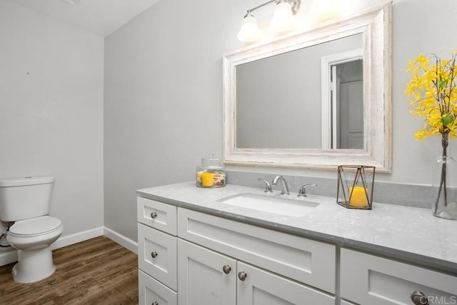 2345 Levante St, Carlsbad, CA 92009 - bathroom with vanity, toilet, wood finished floors, and baseboards