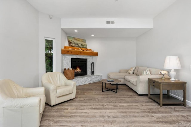 2345 Levante St, Carlsbad, CA 92009 - living room featuring light wood-type flooring, a fireplace, recessed lighting, and baseboards