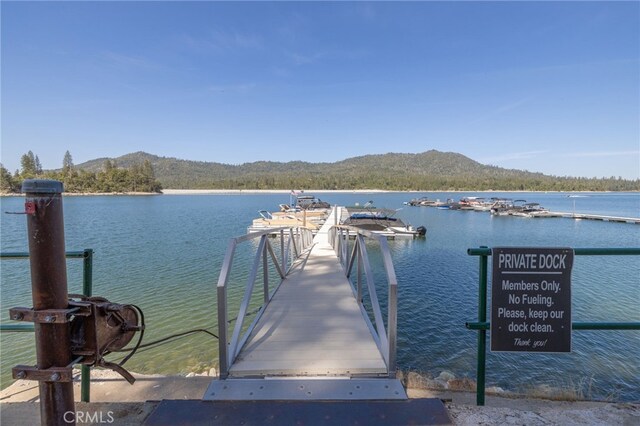 37731 Shoreline Dr, Bass Lake, CA 93604 - dock with a water and mountain view