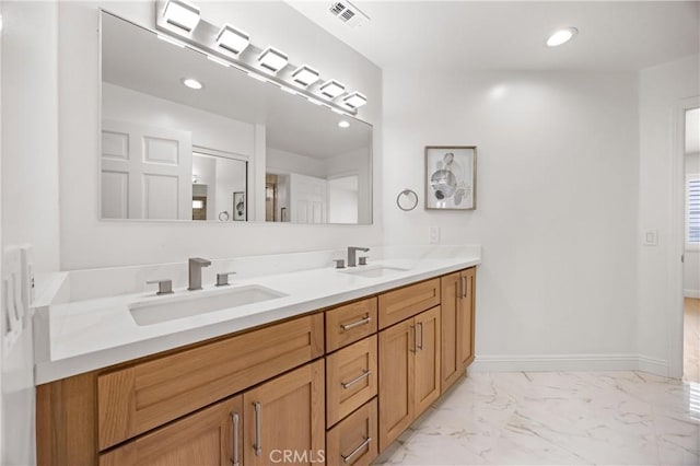 8426 Orange St, Downey, CA 90242 - bathroom with double vanity, marble finish floors, and recessed lighting