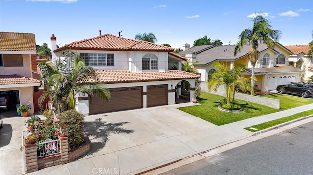 8426 Orange St, Downey, CA 90242 - mediterranean / spanish-style house with a tile roof, an attached garage, stucco siding, driveway, and a front lawn