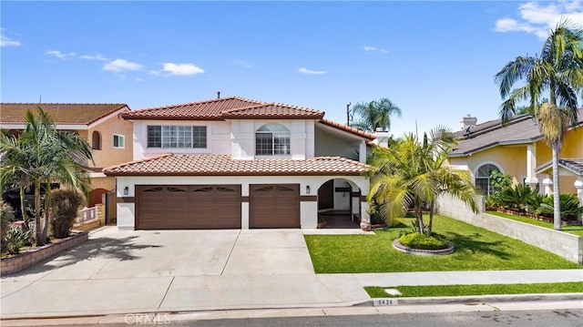 8426 Orange St, Downey, CA 90242 - mediterranean / spanish house with a tiled roof, stucco siding, concrete driveway, an attached garage, and a front lawn