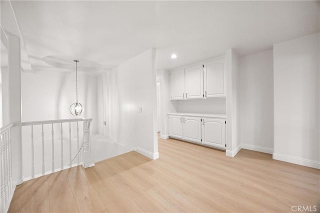 8426 Orange St, Downey, CA 90242 - empty room with light wood-style floors, recessed lighting, and a chandelier
