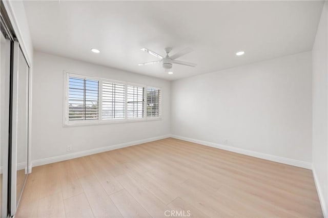 8426 Orange St, Downey, CA 90242 - unfurnished bedroom featuring a closet, recessed lighting, light wood-style floors, and a ceiling fan