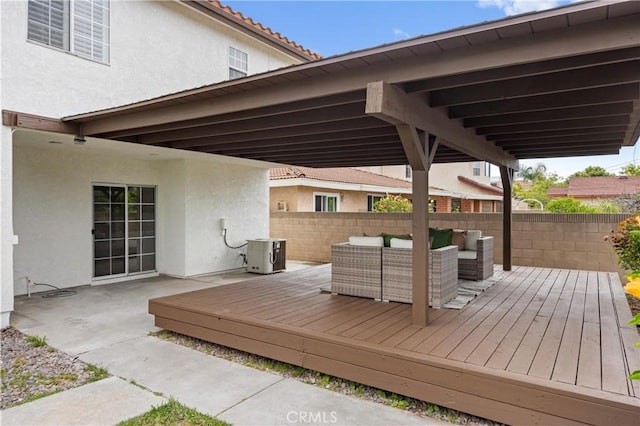 8426 Orange St, Downey, CA 90242 - wooden terrace featuring an outdoor hangout area and a fenced backyard