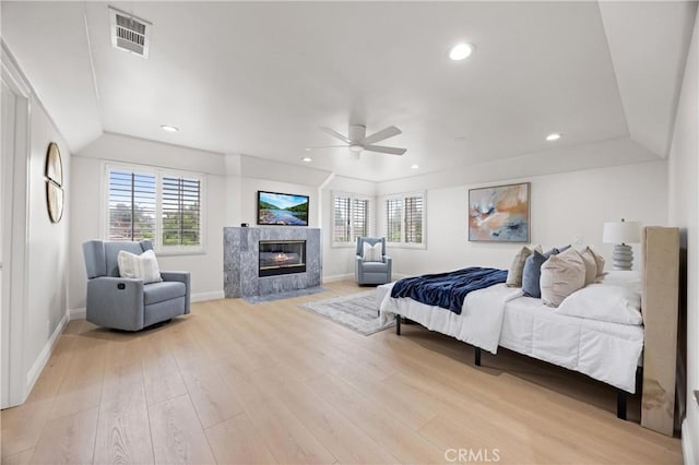 8426 Orange St, Downey, CA 90242 - bedroom with multiple windows, a fireplace, light wood-type flooring, ceiling fan, and recessed lighting