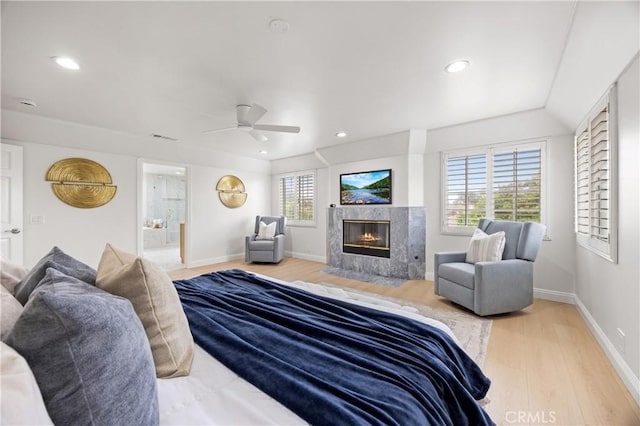 8426 Orange St, Downey, CA 90242 - bedroom with wood finished floors, a premium fireplace, recessed lighting, ceiling fan, and connected bathroom