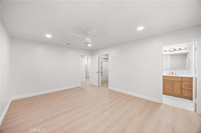 8426 Orange St, Downey, CA 90242 - unfurnished bedroom featuring light wood finished floors, recessed lighting, a walk in closet, ensuite bath, and a closet