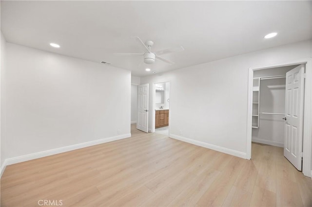 8426 Orange St, Downey, CA 90242 - unfurnished bedroom featuring a spacious closet, light wood finished floors, recessed lighting, a closet, and ceiling fan