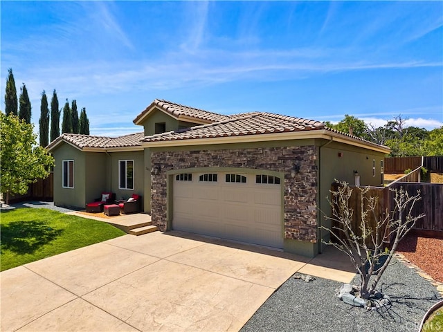 283 Katie Ct, Lakeport, CA 95453 - view of front of house featuring stone siding, concrete driveway, an attached garage, stucco siding, and a tiled roof
