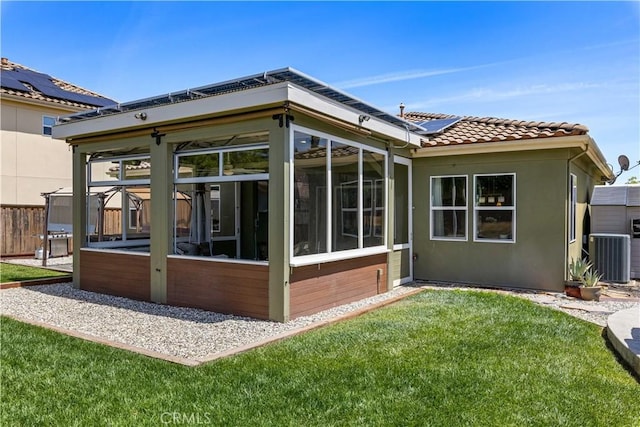 283 Katie Ct, Lakeport, CA 95453 - rear view of house featuring a sunroom, cooling unit, solar panels, and a tile roof