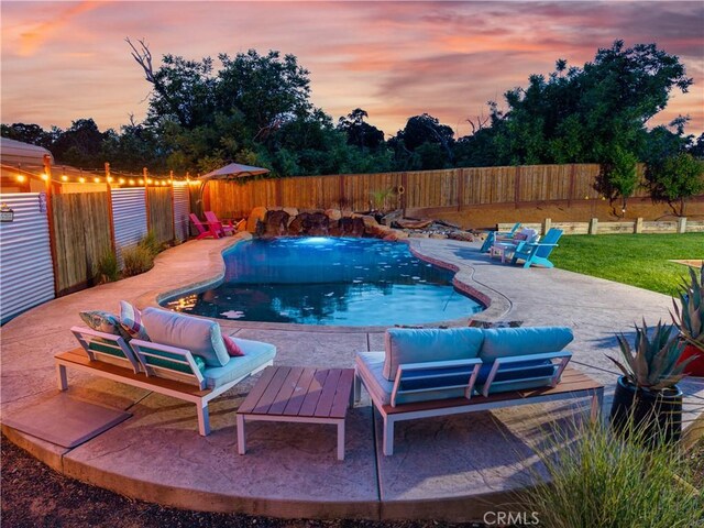 283 Katie Ct, Lakeport, CA 95453 - pool at dusk featuring a patio area, a fenced backyard, and an outdoor hangout area