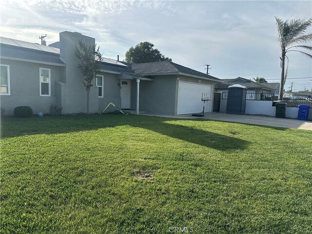 114 S Acacia Ave, Rialto, CA 92376 - view of front of home with stucco siding, a garage, driveway, and a gate