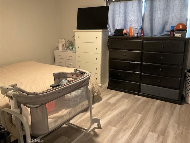 114 S Acacia Ave, Rialto, CA 92376 - bedroom with light wood-type flooring