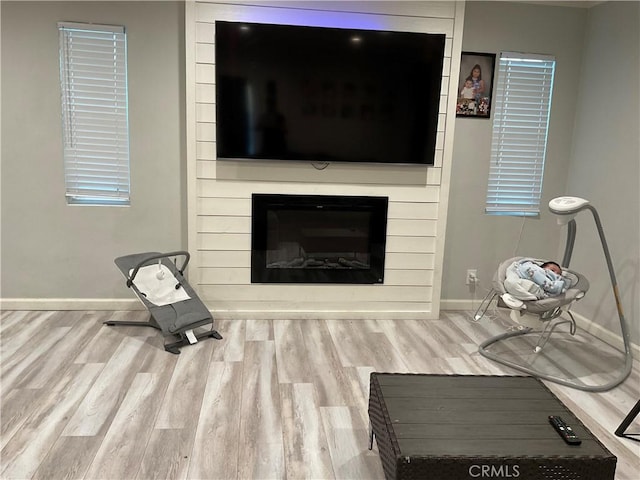 114 S Acacia Ave, Rialto, CA 92376 - living area featuring wood finished floors and a large fireplace