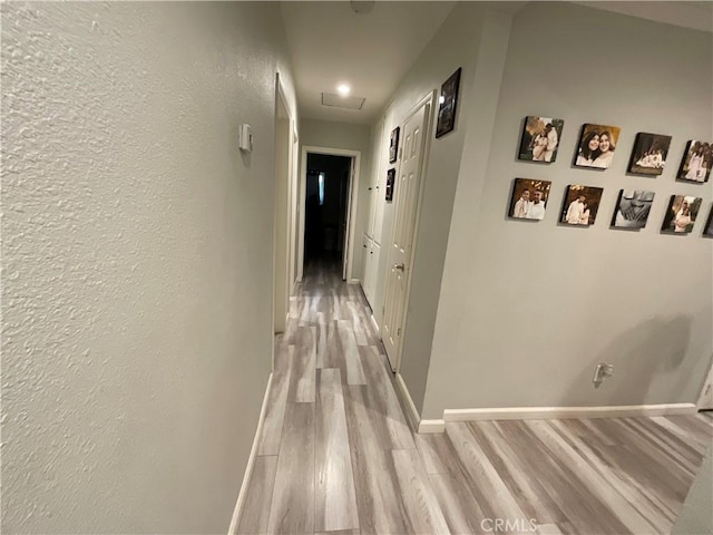 114 S Acacia Ave, Rialto, CA 92376 - hall with light wood finished floors and a textured wall