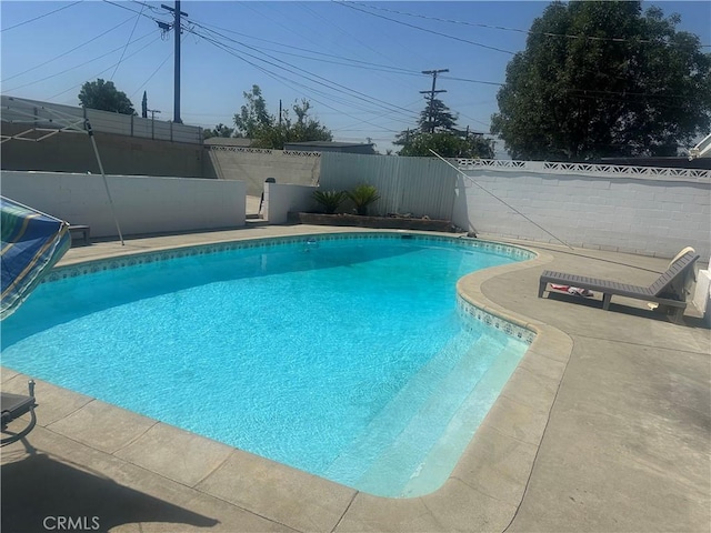 114 S Acacia Ave, Rialto, CA 92376 - view of swimming pool featuring a fenced backyard and a patio area