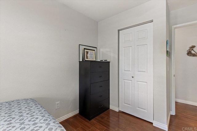 10214 Michala Pl, Santee, CA 92071 - bedroom with baseboards, dark wood-style flooring, and a closet