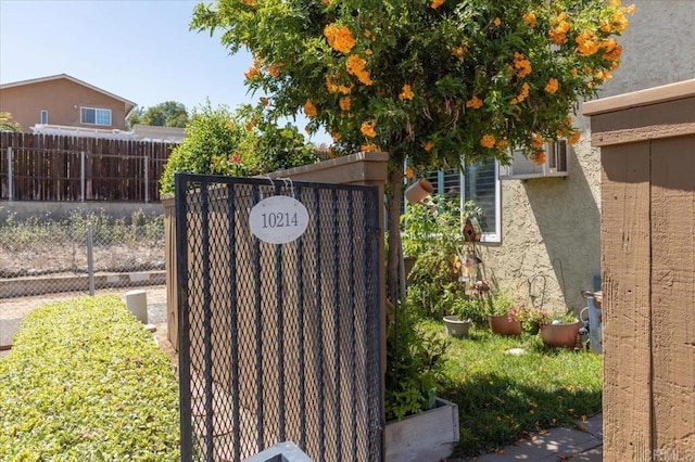 10214 Michala Pl, Santee, CA 92071 - exterior view of stucco siding and a gate