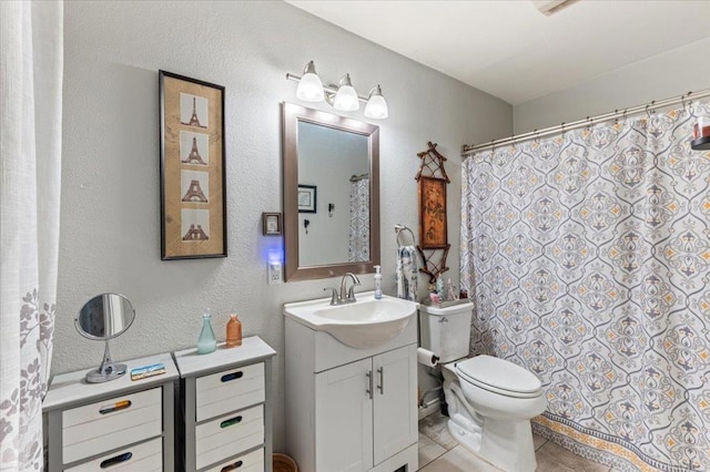 10214 Michala Pl, Santee, CA 92071 - full bathroom with vanity, toilet, tile patterned floors, and a textured wall