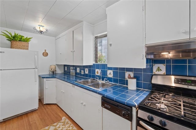 745 Crane Blvd, Los Angeles, CA 90065 - kitchen featuring white appliances, tile countertops, under cabinet range hood, a sink, and white cabinets