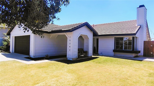 15343 Oakham Ct, Moreno Valley, CA 92551 - ranch-style home with a garage, a tiled roof, and a chimney