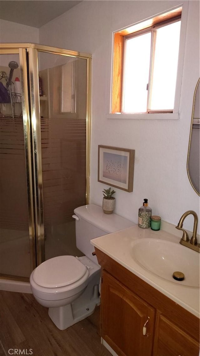 15343 Oakham Ct, Moreno Valley, CA 92551 - full bathroom featuring vanity, a shower stall, toilet, and wood finished floors