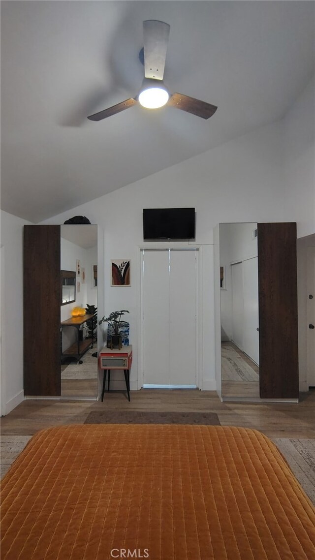 15343 Oakham Ct, Moreno Valley, CA 92551 - bedroom with lofted ceiling, wood finished floors, and ceiling fan