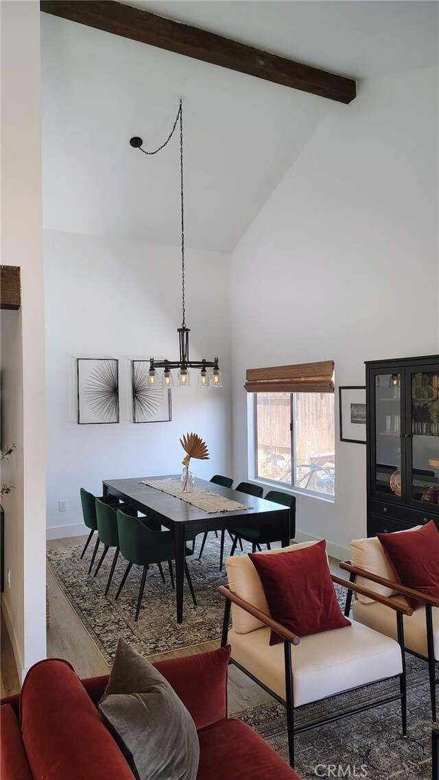 15343 Oakham Ct, Moreno Valley, CA 92551 - dining area featuring high vaulted ceiling, baseboards, wood finished floors, and beam ceiling