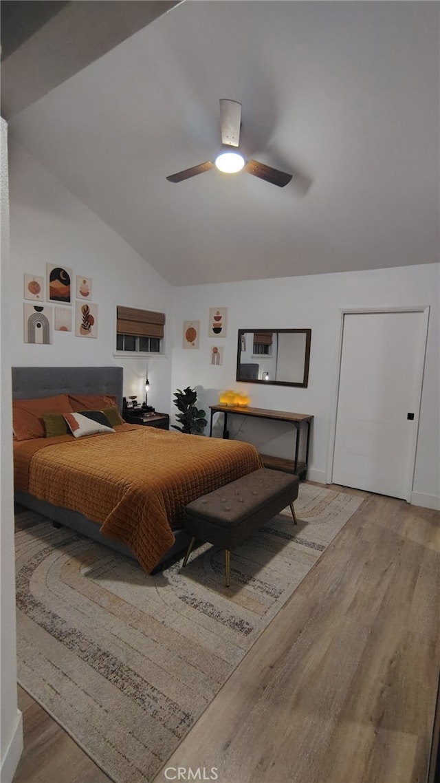 15343 Oakham Ct, Moreno Valley, CA 92551 - bedroom featuring wood finished floors, vaulted ceiling, baseboards, and a ceiling fan