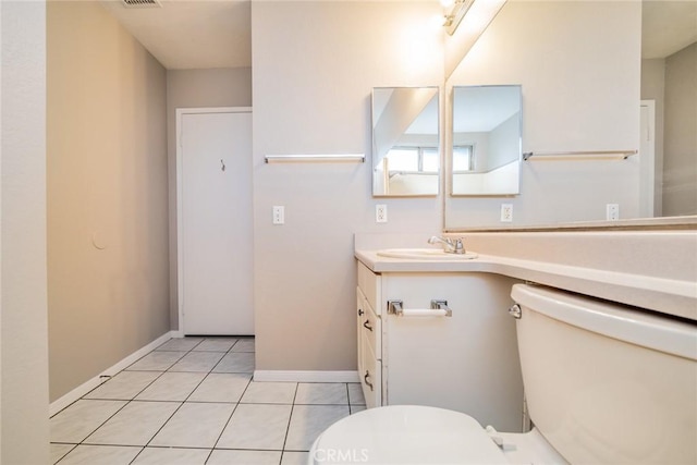 14079 El Camino Pl, Fontana, CA 92337 - bathroom with toilet, vanity, tile patterned flooring, and baseboards