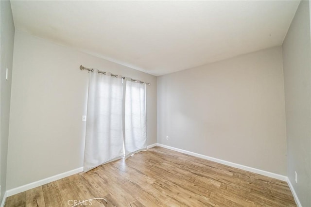 14079 El Camino Pl, Fontana, CA 92337 - unfurnished room featuring light wood-style floors and baseboards