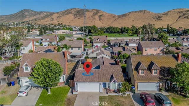 14079 El Camino Pl, Fontana, CA 92337 - aerial perspective of suburban area with a mountain backdrop